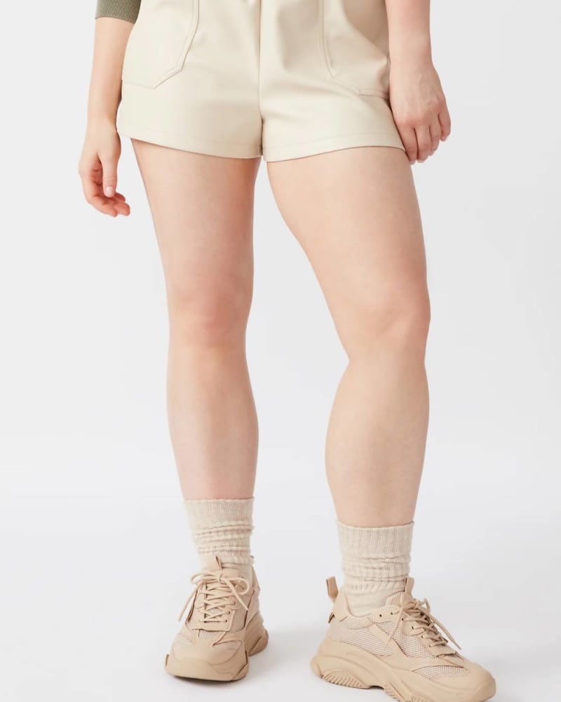 Front of a model wearing a size L Faux The Record Short In Bone in Bone by STEVE MADDEN. | dia_product_style_image_id:353474